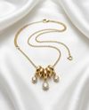 Aurelia Multiple Rings and Round Crystal Drop Charm Necklace